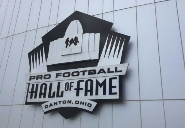 The logo of the Pro Football Hall of Fame on the side of the building